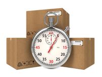 Stopwatch Over a Carton Boxes. Express Delivery Concept Micro